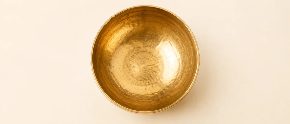 Looking down into a hand-forged ANURAVA bell-metal bowl